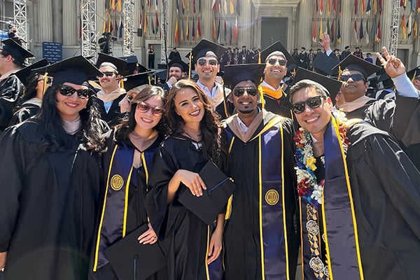Atusa Sadeghi and friends pose for a group photo at graduation