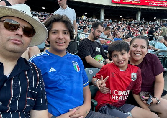 Lupe Alonzo-Diaz sitting in a stadium. 